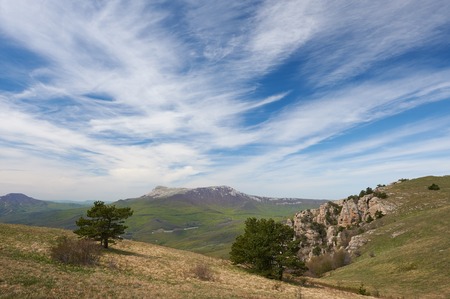 Summer landscape of the southern Crimea, overlooking the Black Sea and the surrounding mountains, in the bottom of Alushta. In the foreground weathered pillars called Valley of ghosts, Rossia.の写真素材