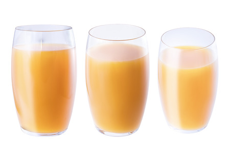 Peach juice in a glass glass, isolate on a white background, three angles, closeup.の写真素材