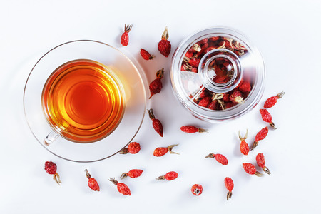 Herbal tea from rose hips, vitamin drink, hips, based on white, top view.の写真素材