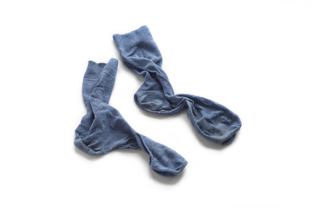 Clean laundered men's socks on a white background