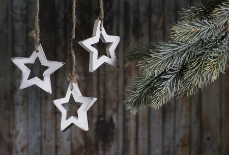 Christmas garland of wooden stars on the background of the old wooden planks.の写真素材