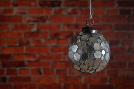Mirror Christmas ball on the brick wall background.の写真素材