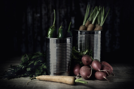 Fresh rustic vegetables on a dark wooden table.の写真素材