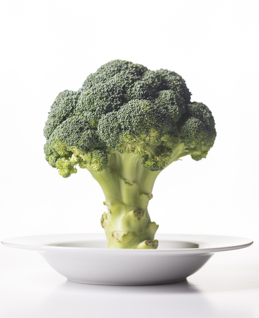 Ripe fresh green cabbage on white clean plate.の写真素材