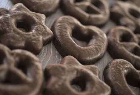 Chocolate cookies in the form of figurines on a wooden table.の写真素材