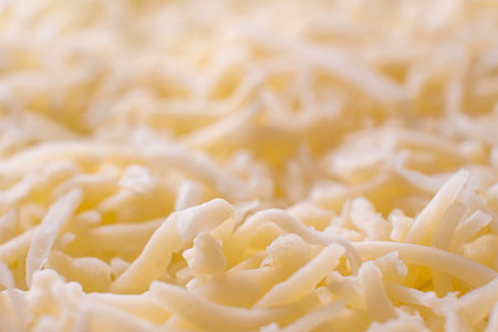 Graded cheese close up. macro.の写真素材