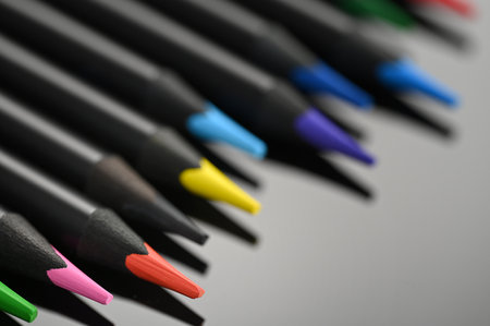 Colorful pencils on gray background, closeup. school suppliesの写真素材