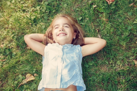 Little happy girl plaing in the parcの写真素材