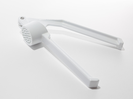 White garlic press isolated on white backgroundの写真素材