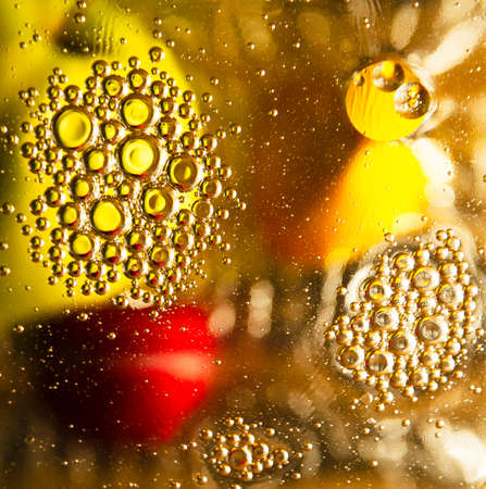 Abstraction in light colors with yellow and red objects and bubbles in defocus 2の写真素材