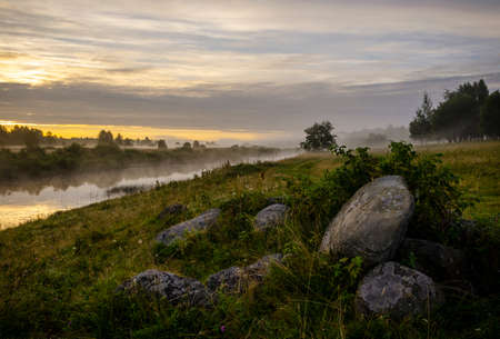 A quiet peaceful sunrise on the river.の写真素材