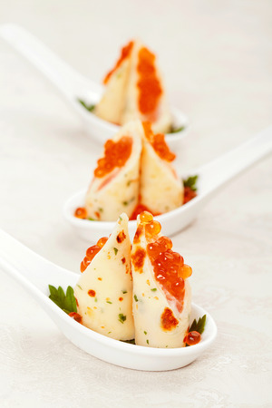 pita bread with salmon and caviar on a plate close upの写真素材