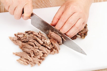 the process of cutting the boiled beef closeupの写真素材