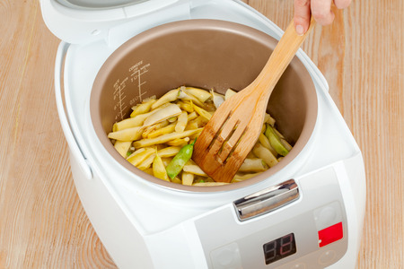 The process of cooking green beans in multicooker closeupの写真素材