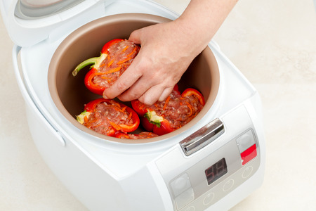 cooking stew stuffed red peppers in multicooker closeupの写真素材