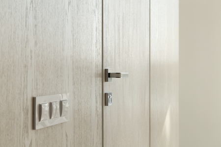 Closeup of a door handle in a modern interior. Detail in the interiorの写真素材