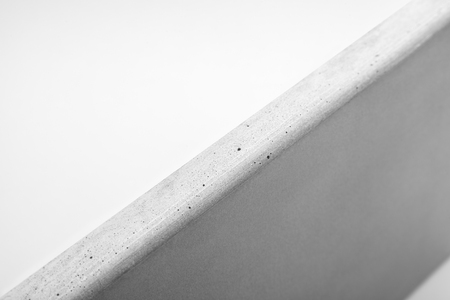 Closeup of natural concrete countertop against a white backgroundの写真素材