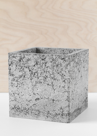 Brutal grey pot of fibrous concrete for indoor plantsの写真素材