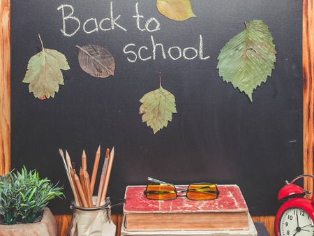 School board, old books, alarm clock, herbarium. Back to school conceptの写真素材