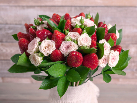 Delicious bouquet of strawberries and roses. Close upの写真素材