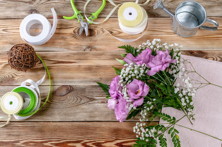 Workplace florist. Top view. Copy space. Wooden background.の写真素材