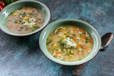 Pea soup with smoked meat, vegetables and greens. Delicious and healthy homemade food.の写真素材