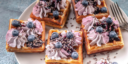 Food banner. Homemade Belgian waffles with cream, jam, blueberry and mint leaves. Delicious Dessertの写真素材