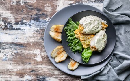Squid stuffed with vegetables and rice. Stewed zucchini, carrots and potatoes. Top view. Copy spaceの写真素材