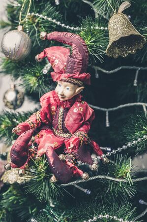 Christmas or New Year decorative toy. Joker Doll on Christmas tree. Close-upの写真素材
