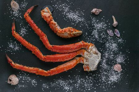Close-up Red crab claw on a black background. Top view. Seafoodの写真素材
