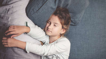 Portrait of a sleepy teenage girl. When hard to wake up in the morning. Lifestyle photoの写真素材