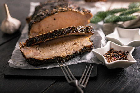 Delicious homemade cold boiled pork with spices. Pork appetizer for Christmas tableの写真素材