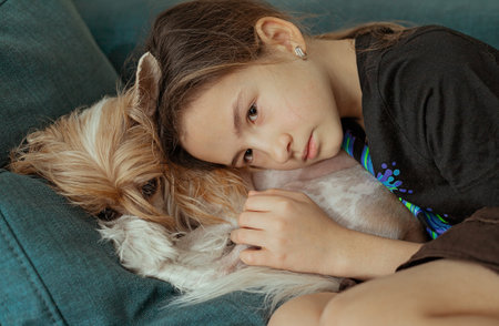 Beautiful girl sleeping with her dog. Best friends. Lifestyleの写真素材
