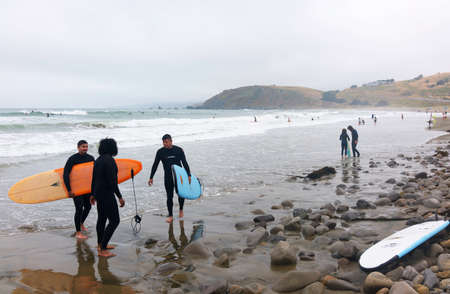 Surfers on the spot. Pacific ocean coast