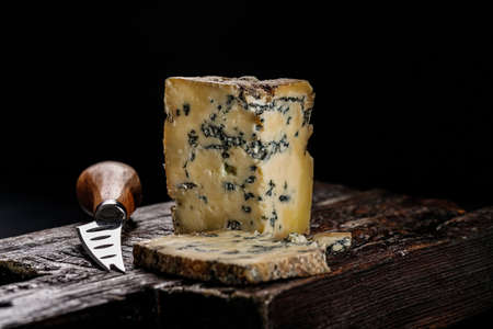 Semi-soft cheese with mold made from cows milk. The king of blue cheeses is Stilton. Piece of cheese...