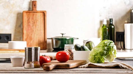 Delicious and healthy vegetables. Ripe tomatoes, fresh cucumbers and crispy ice salad, avocado. Food...