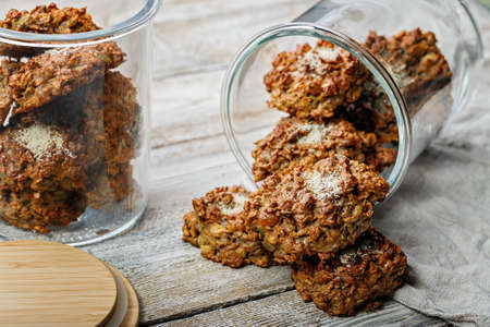 Homemade healthy gluten-free oatmeal cookies. Healthy food or fitness snack. Oats, isolated milk...