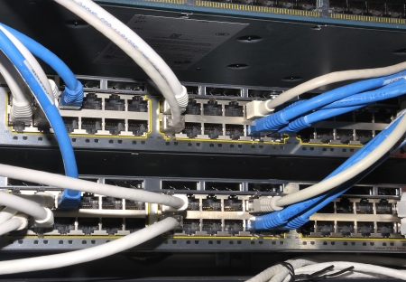 Ethernet cables are connected to internet switch.のeditorial素材