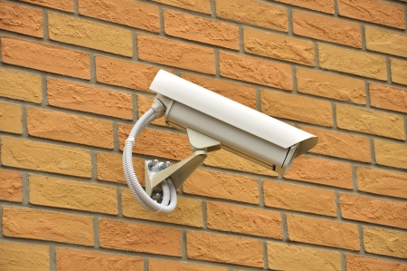Security surveillance video camera on the wall