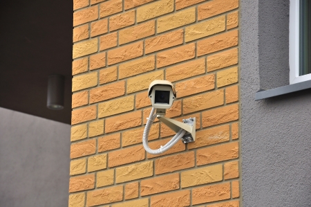 Security surveillance video camera on the wallの写真素材