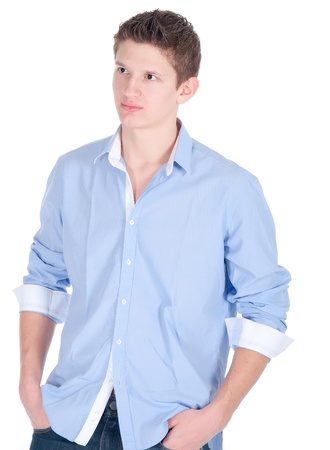 Portrait of handsome young man in casual clothes standing over white background.の写真素材