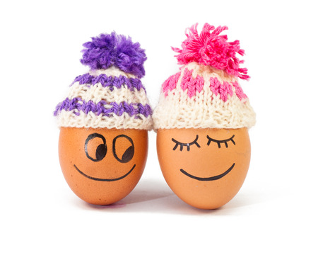 funnylovely eggs in winter hats. together is more warmer .の写真素材