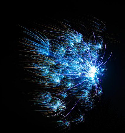 Outbreaks of fireworks in the night sky の写真素材