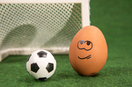 funny egg and football. prepare for a battle.