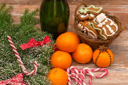 Two champagne glasses ready to bring in the New Year over wooden backgroundの写真素材