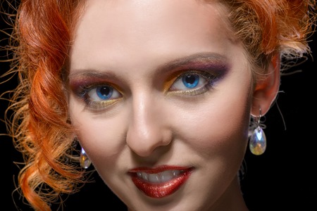Red Haired Girl beauty Portrait over Black.の写真素材