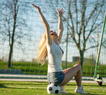 Serious Soccer Fan Girl with The Ballの写真素材