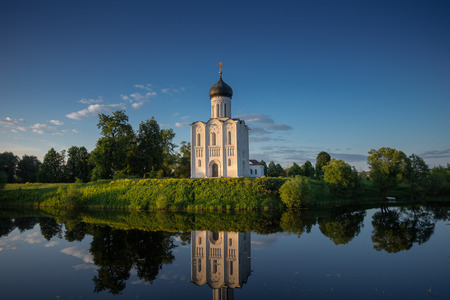 Old church on the lake shoreの写真素材