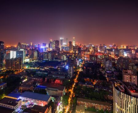 Futuristic modern city, at night, a lot of lights and signage.の写真素材