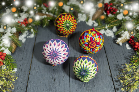 New Year's wreath from a green Christmas tree with cones on a wooden backgroundの写真素材